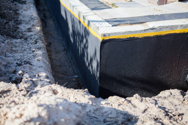 Professional Waterproofing technician working in Adell, WI
